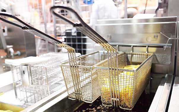 Fryer baskets in a commercial kitchen