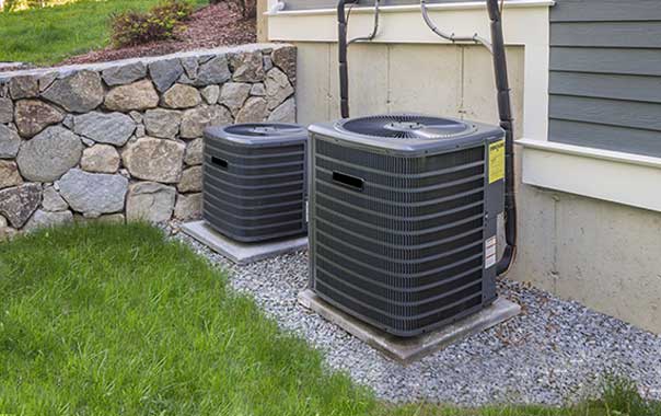 Outdoor air conditioning condenser units beside a building