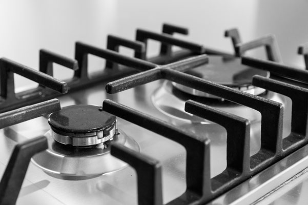 Close view of stainless steel gas range burners